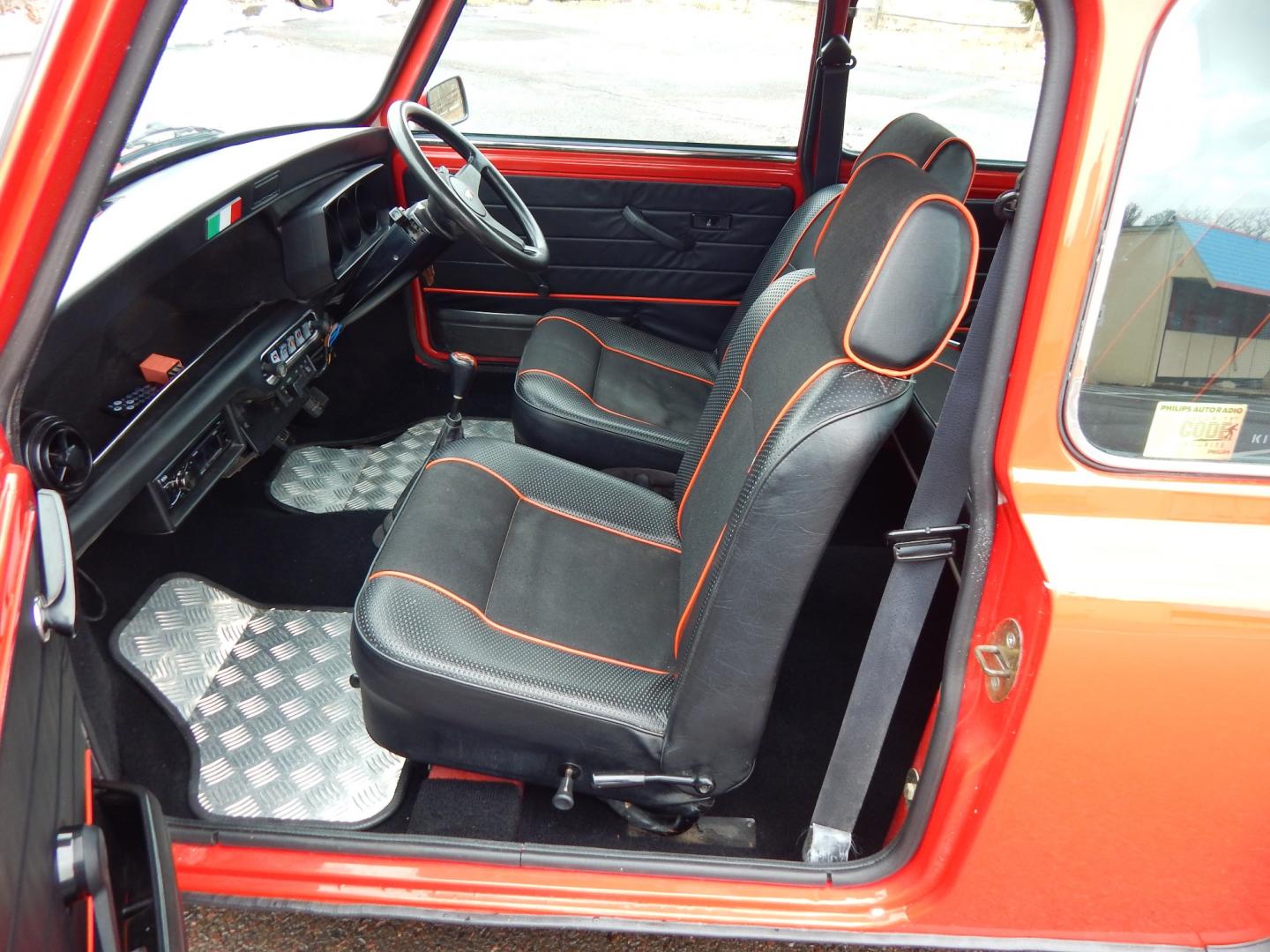 1981 RED /Black Cloth Austin Mini Cooper (AA25AU11248) with an 1275 CC engine, 4 speed manual transmission, located at 6528 Lower York Road, New Hope, PA, 18938, (215) 862-9555, 40.358707, -74.977882 - Very cool, great driving 1981 Austin Mini-Cooper. We believe it is a 1981 due to the rear taillights. The title shows it as a 1969 model year, however the cars built in the 1960s had outside door hinges. Also , the windows were sliding instead of the roll up windows this vehicle has.. Red/ whit - Photo#15